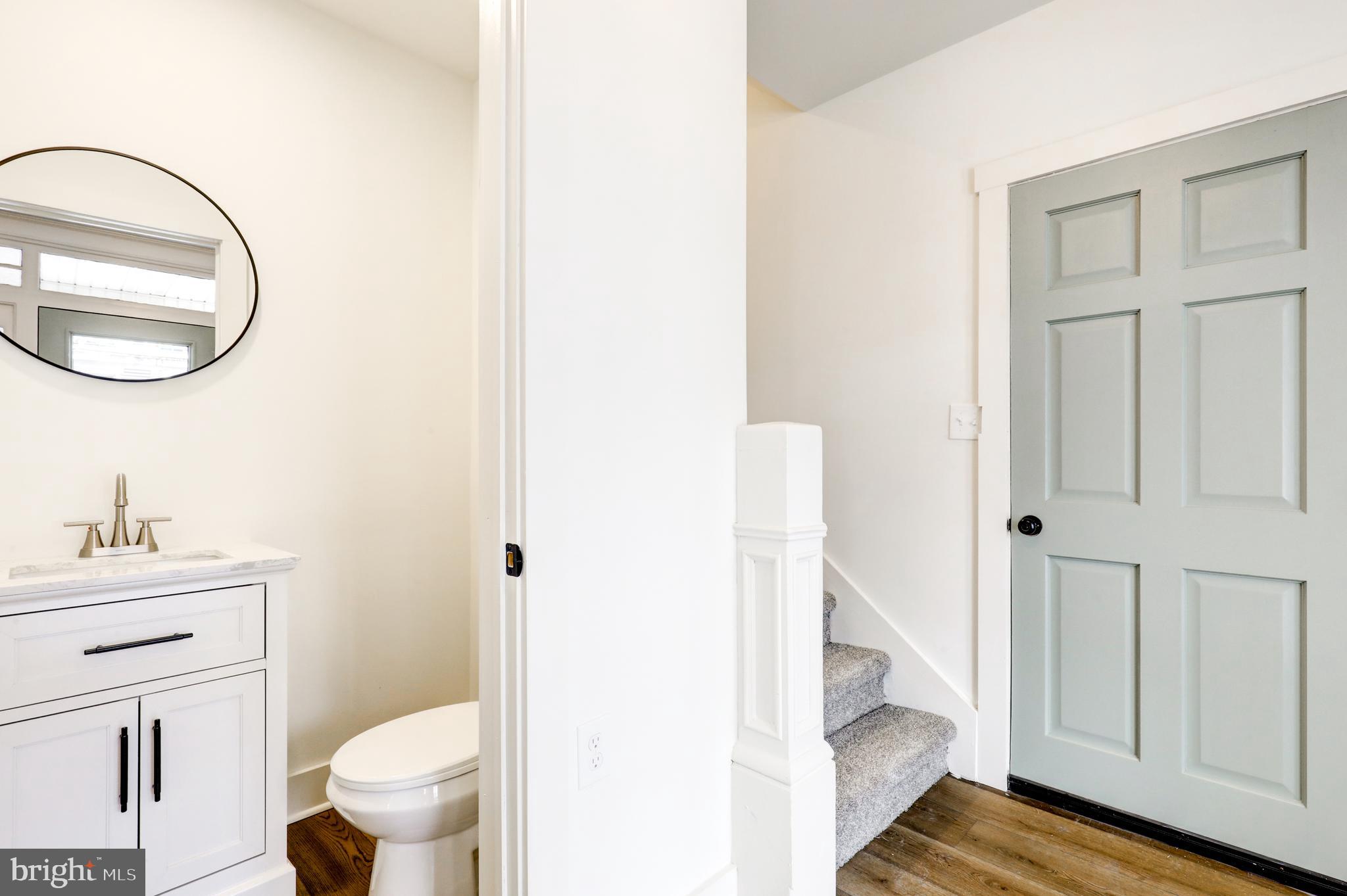 711 Main Street Lykens, PA 17048 - Photo 4 of 38 a bathroom with a sink a toilet and a mirror