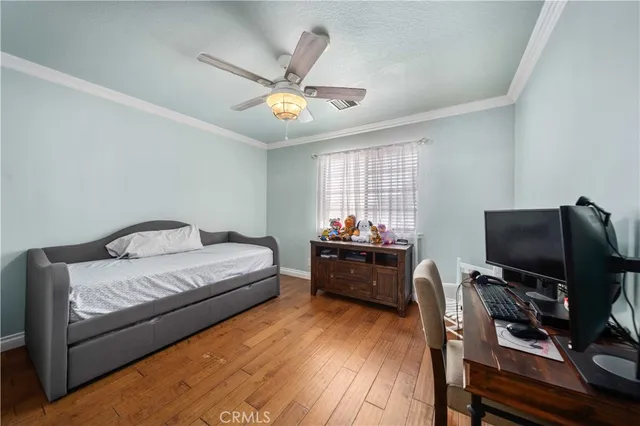 a bedroom with furniture and a window