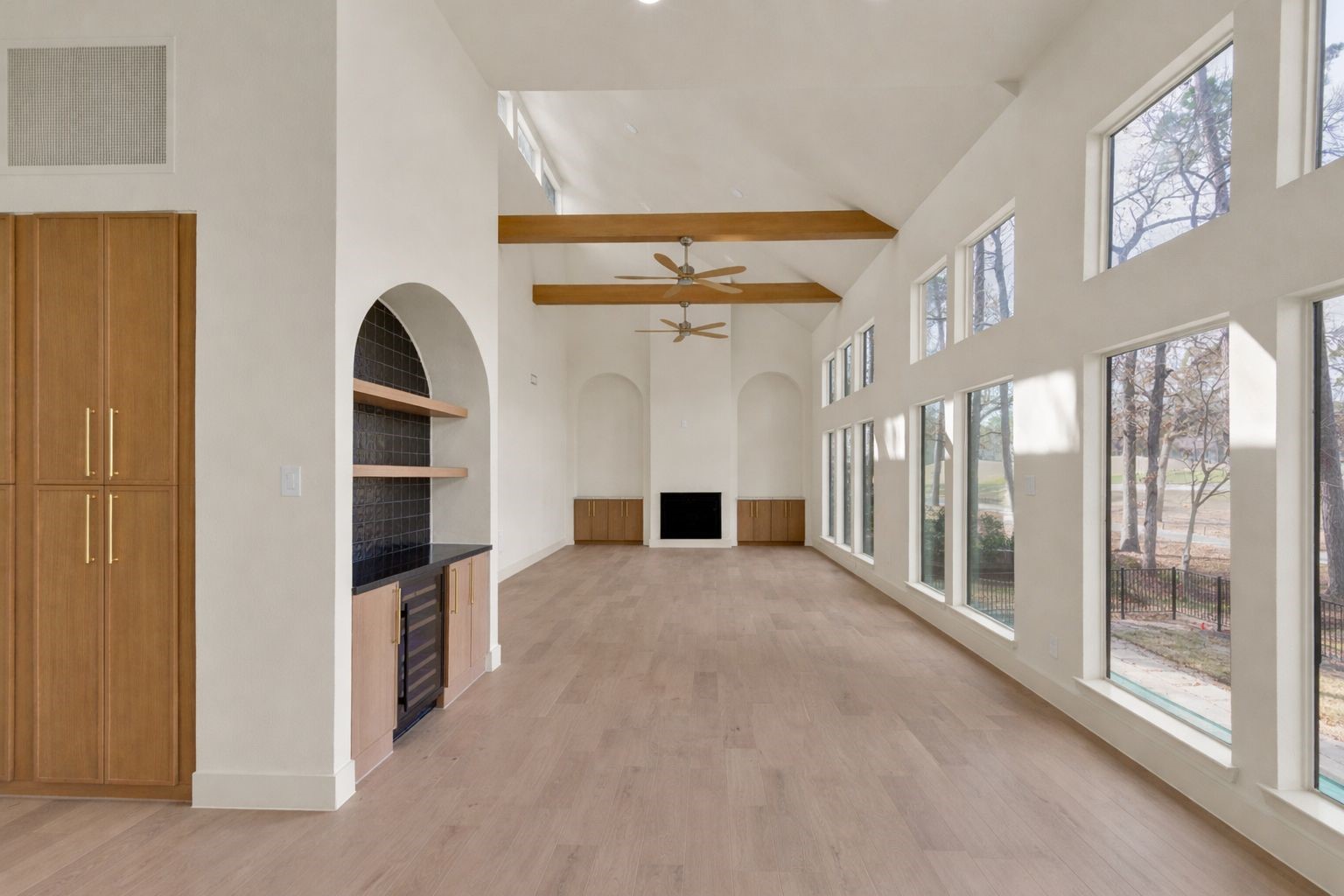 20 Buttonbush Court The Woodlands, TX 77380 - Photo 14 of 43 a view of entryway with hallway and wooden floor