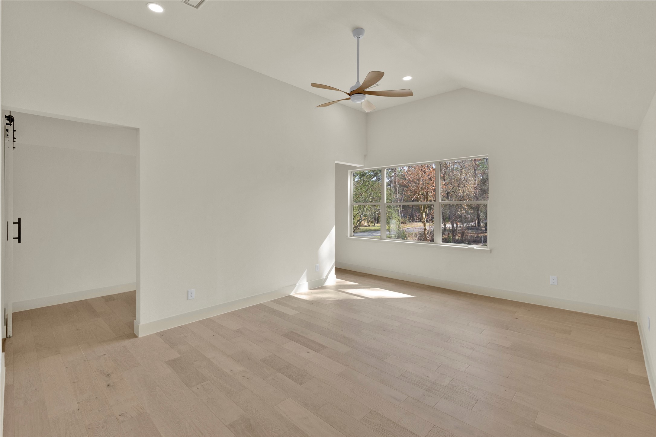 20 Buttonbush Court The Woodlands, TX 77380 - Photo 19 of 43 an empty room with windows