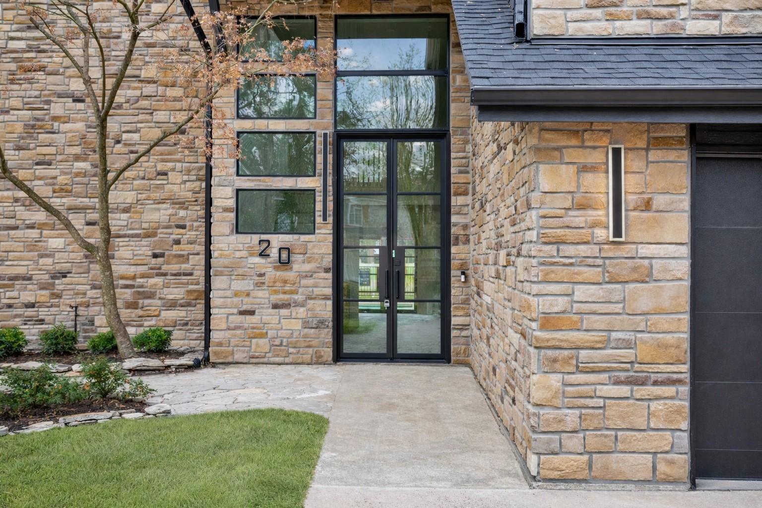 20 Buttonbush Court The Woodlands, TX 77380 - Photo 2 of 43 a view of front door of house with a outdoor space