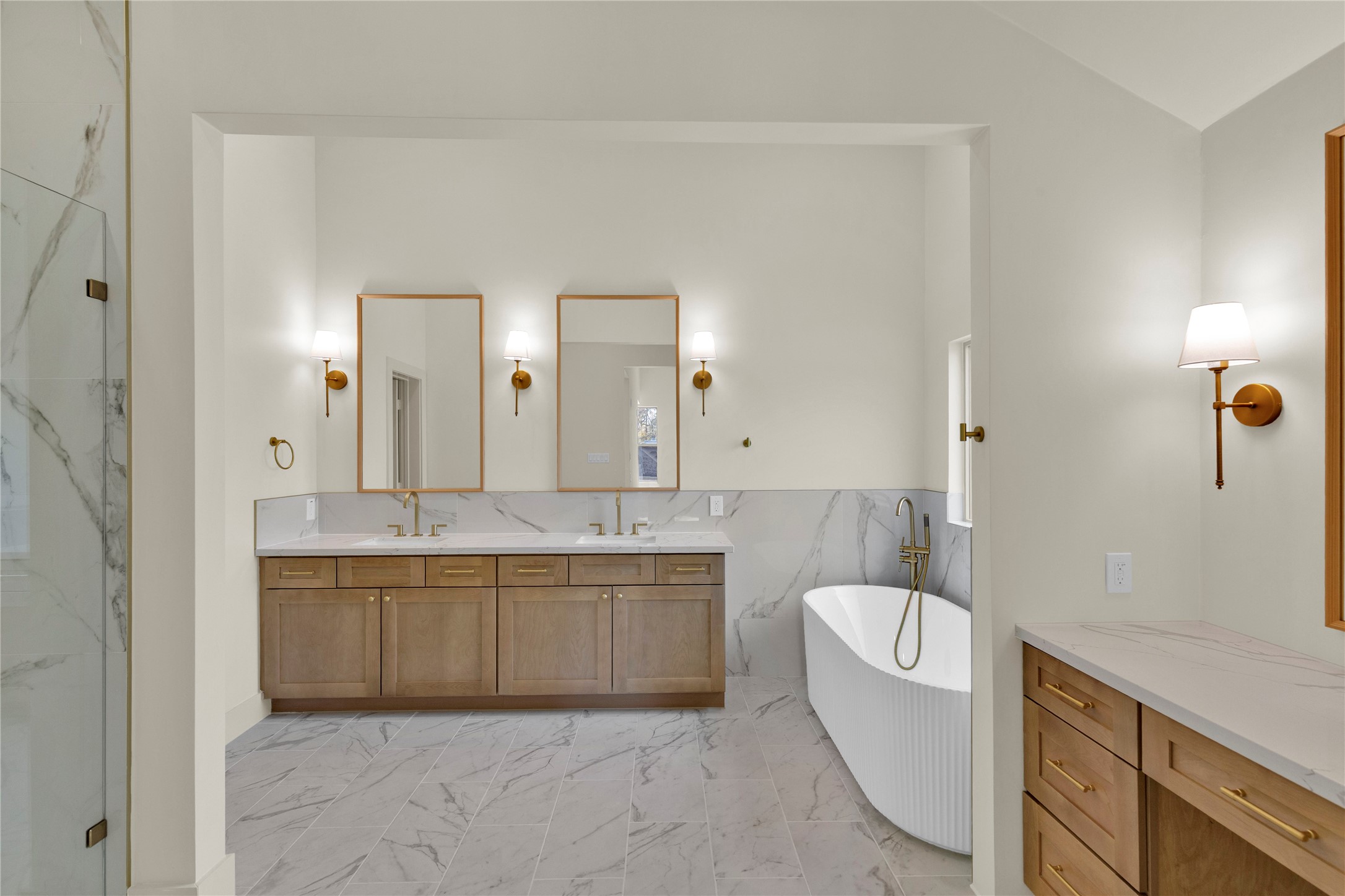 20 Buttonbush Court The Woodlands, TX 77380 - Photo 21 of 43 a spacious bathroom with a granite countertop sink mirror and bathtub