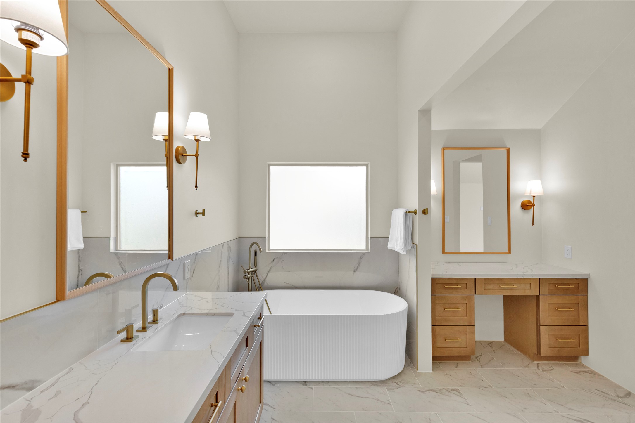 20 Buttonbush Court The Woodlands, TX 77380 - Photo 22 of 43 a bathroom with a tub sink and a mirror