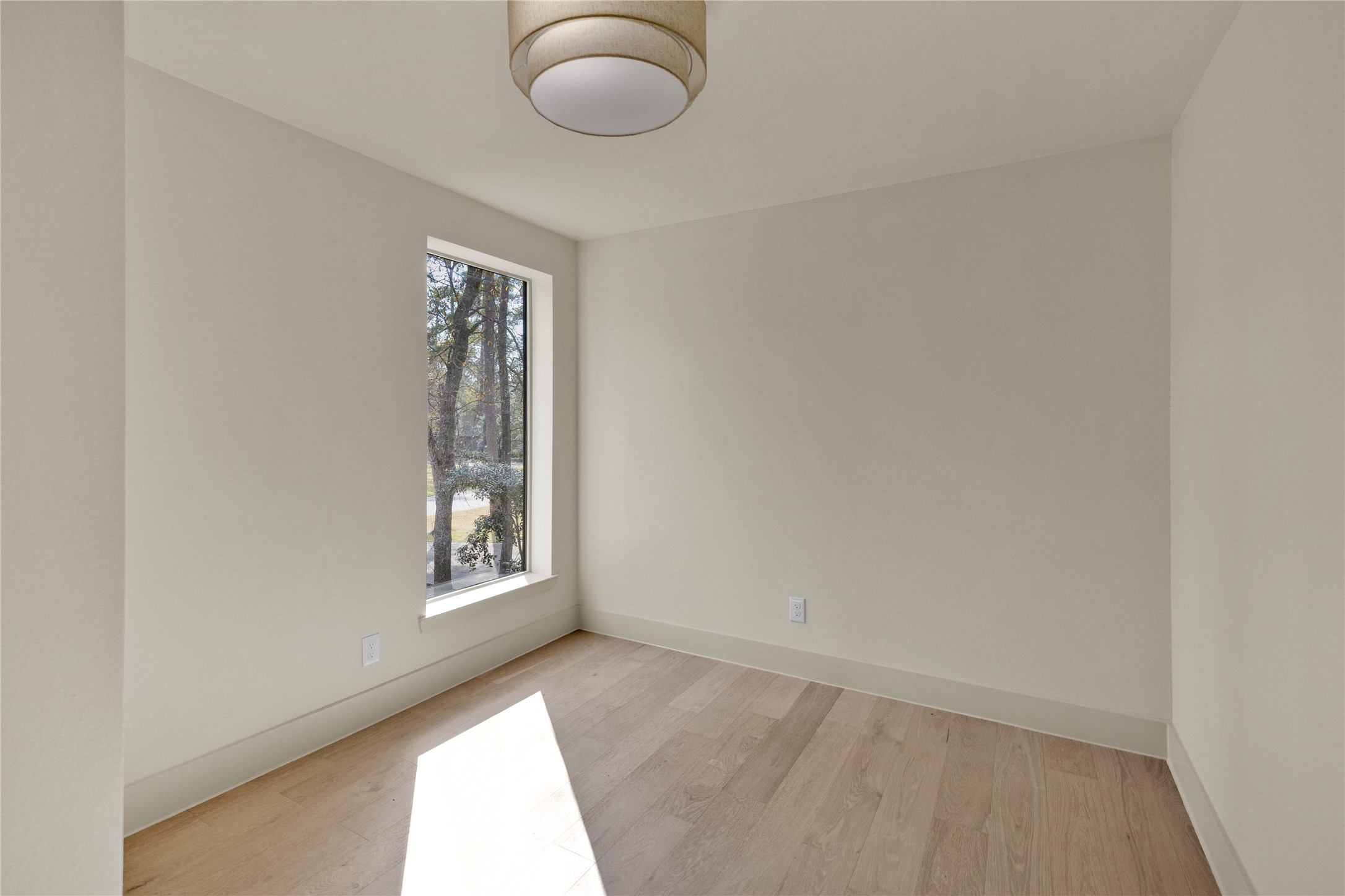 20 Buttonbush Court The Woodlands, TX 77380 - Photo 25 of 43 an empty room with windows