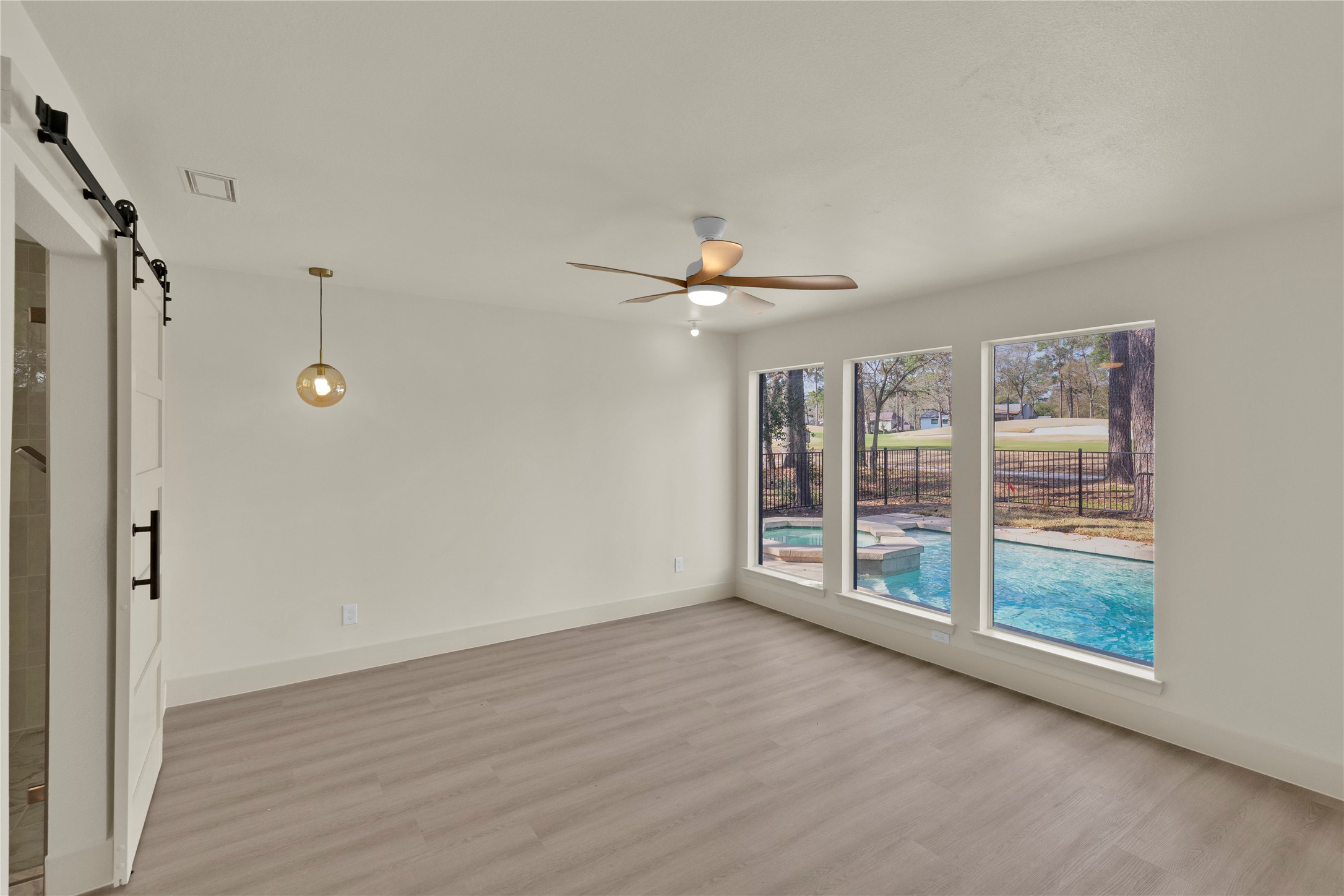 20 Buttonbush Court The Woodlands, TX 77380 - Photo 26 of 43 a view of an empty room with a window
