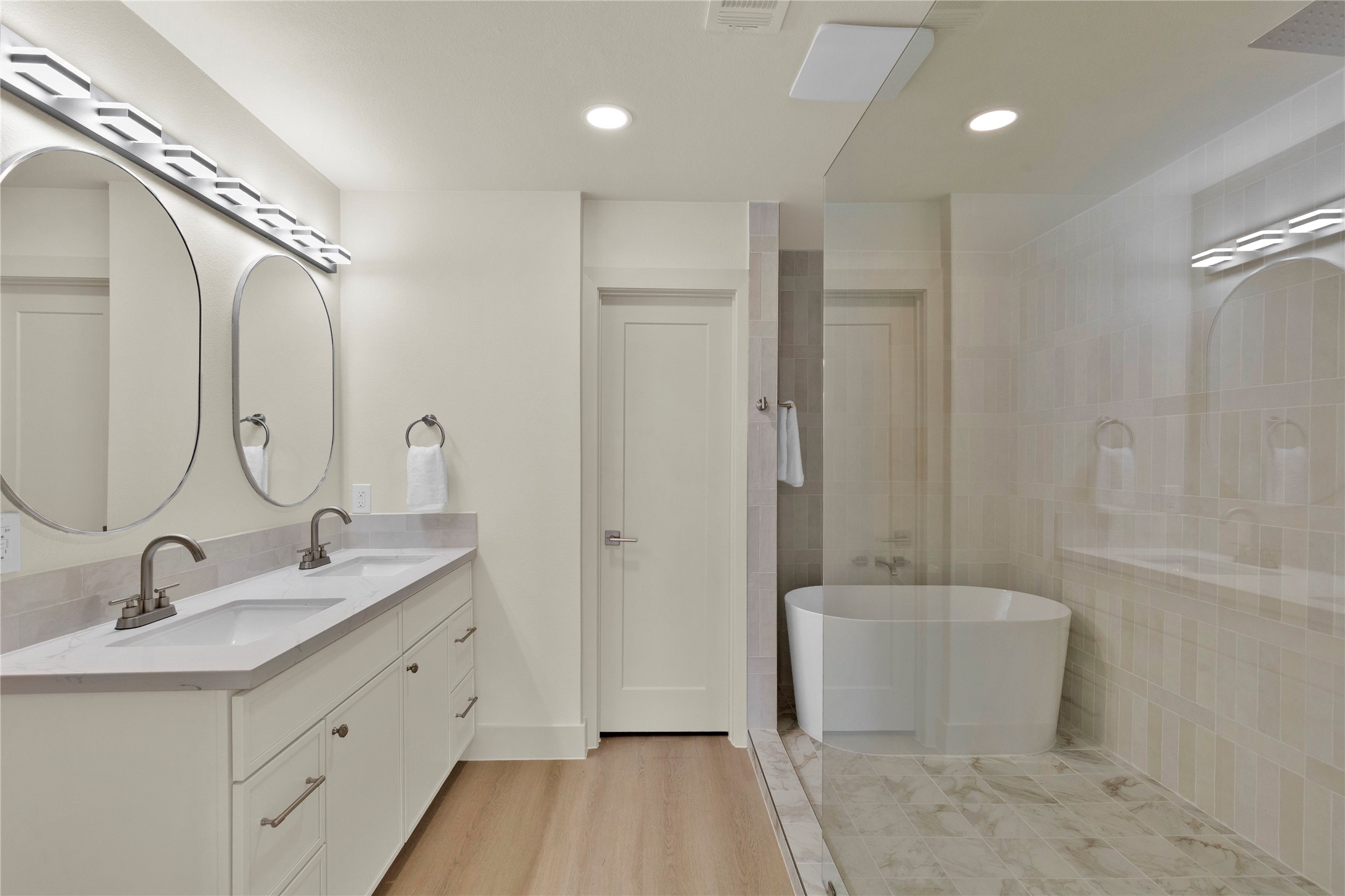 20 Buttonbush Court The Woodlands, TX 77380 - Photo 27 of 43 a bathroom with a sink a toilet and shower