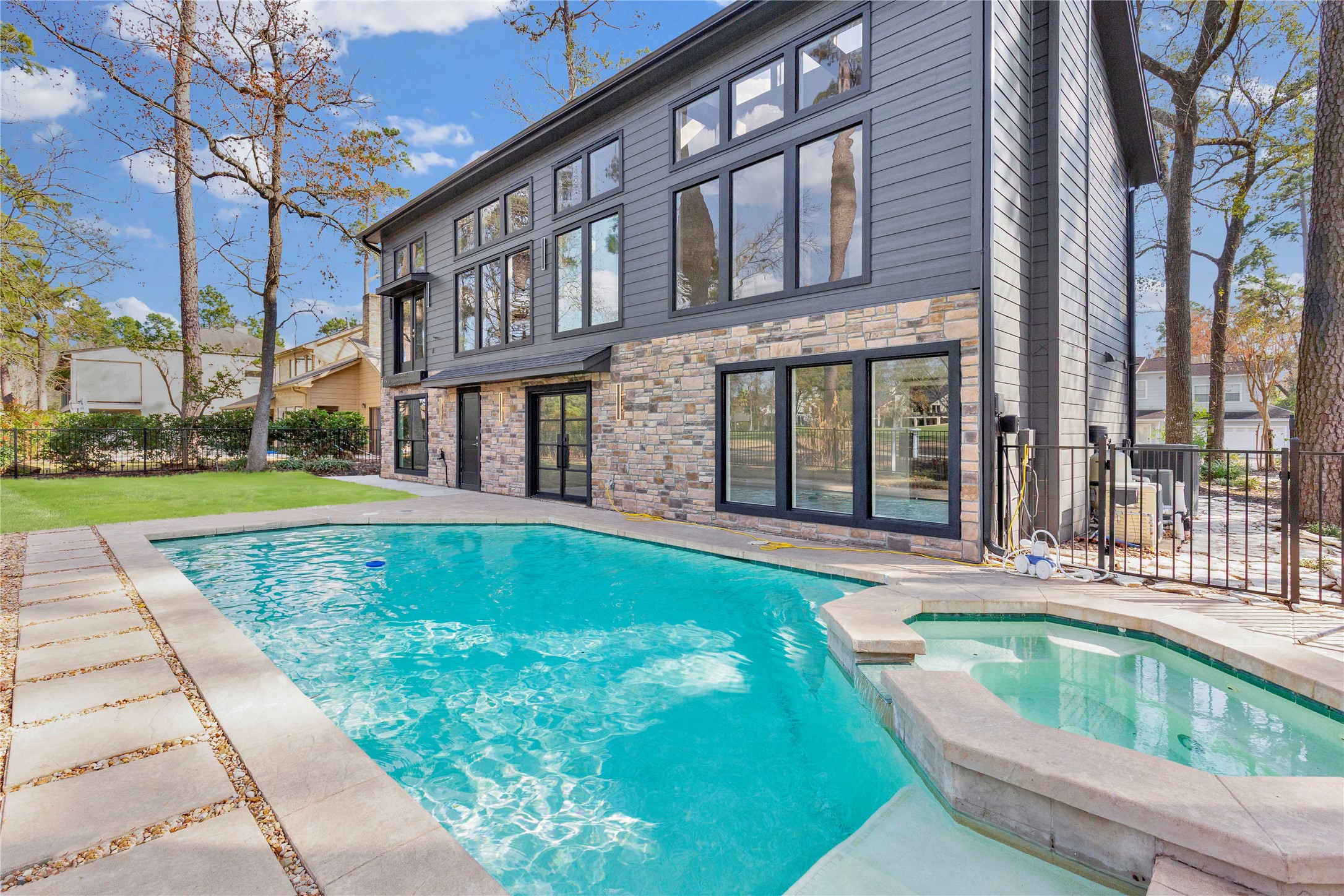 20 Buttonbush Court The Woodlands, TX 77380 - Photo 40 of 43 a view of a house with a swimming pool