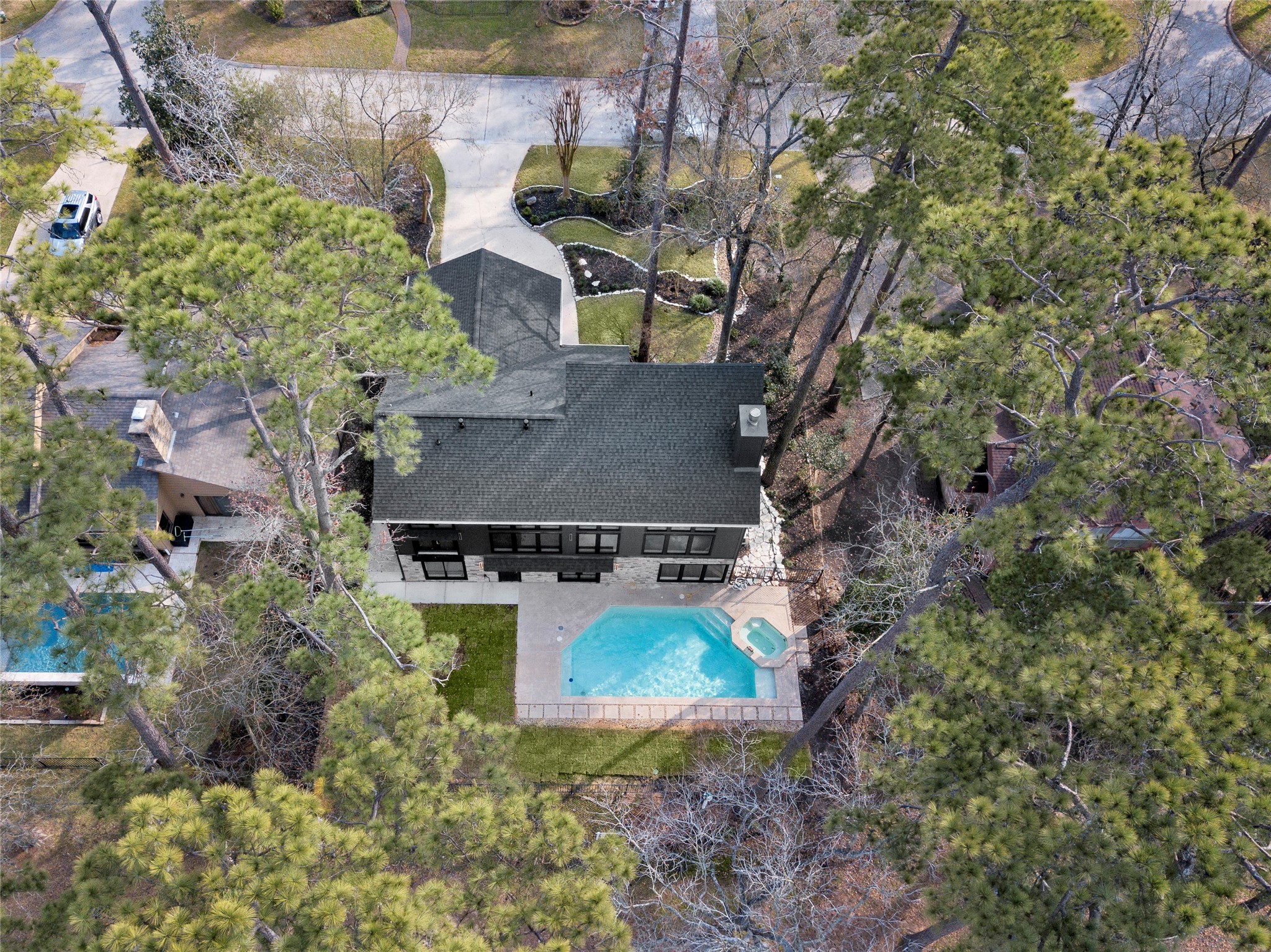 20 Buttonbush Court The Woodlands, TX 77380 - Photo 43 of 43 an aerial view of a house with yard and swimming pool