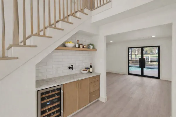 a living room with furniture window and a flat screen tv