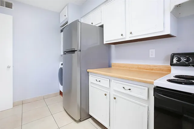 a kitchen with a stove and a refrigerator