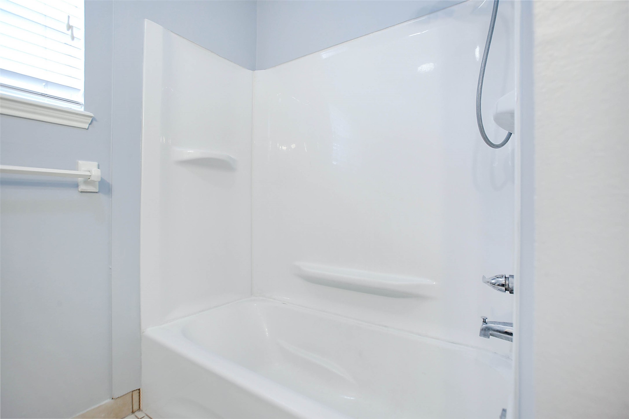 7900 Westheimer Road, Unit 134 Houston, TX 77063 - Photo 20 of 25 a bathroom with a bath tub with a shower