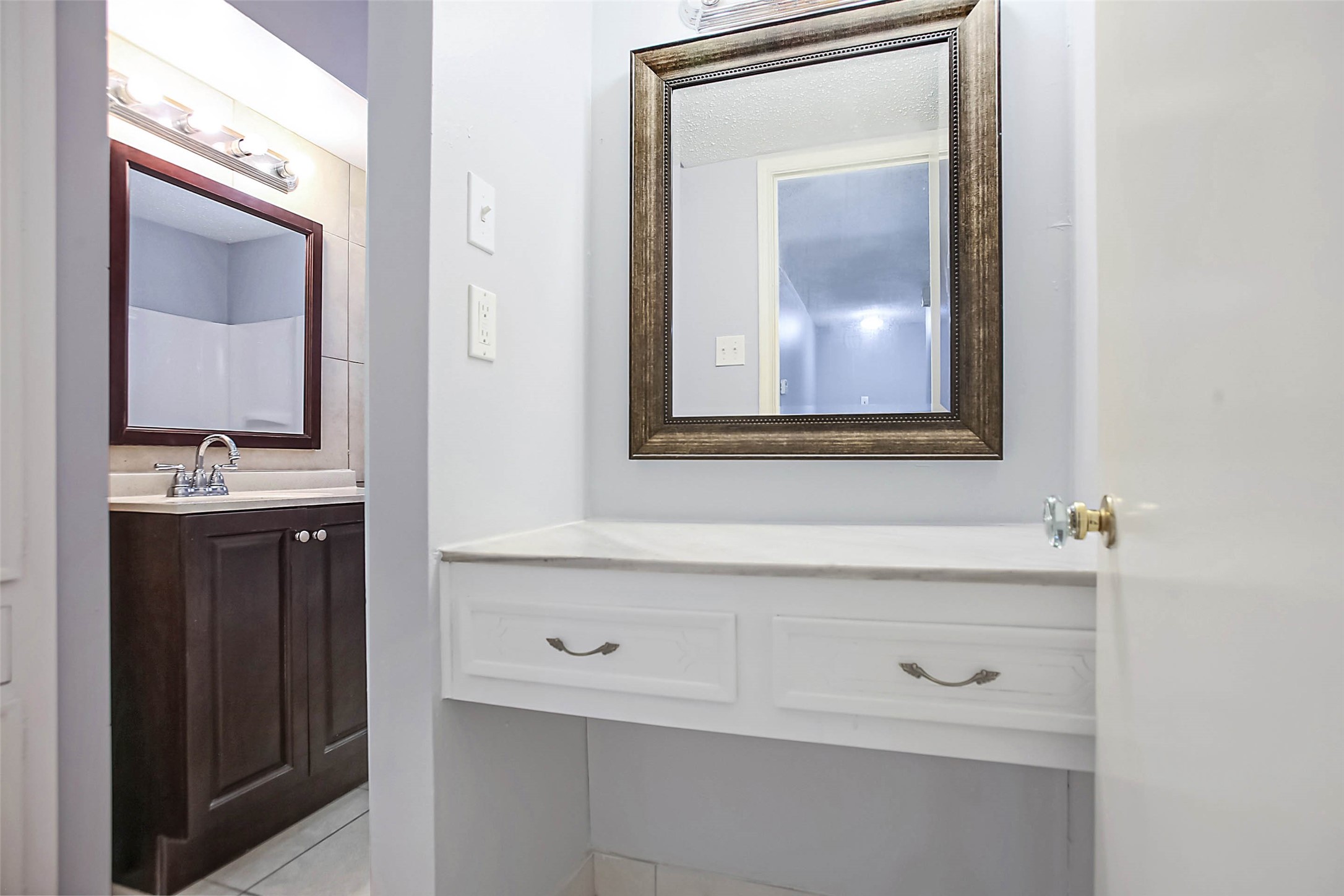 7900 Westheimer Road, Unit 134 Houston, TX 77063 - Photo 21 of 25 a bathroom with a sink vanity and mirror