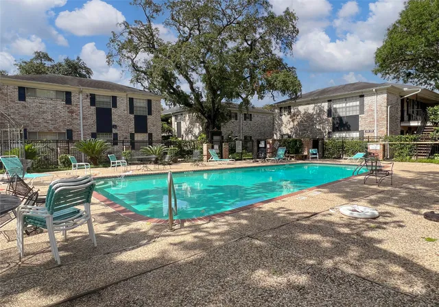 a view of a house with a yard porch and sitting area