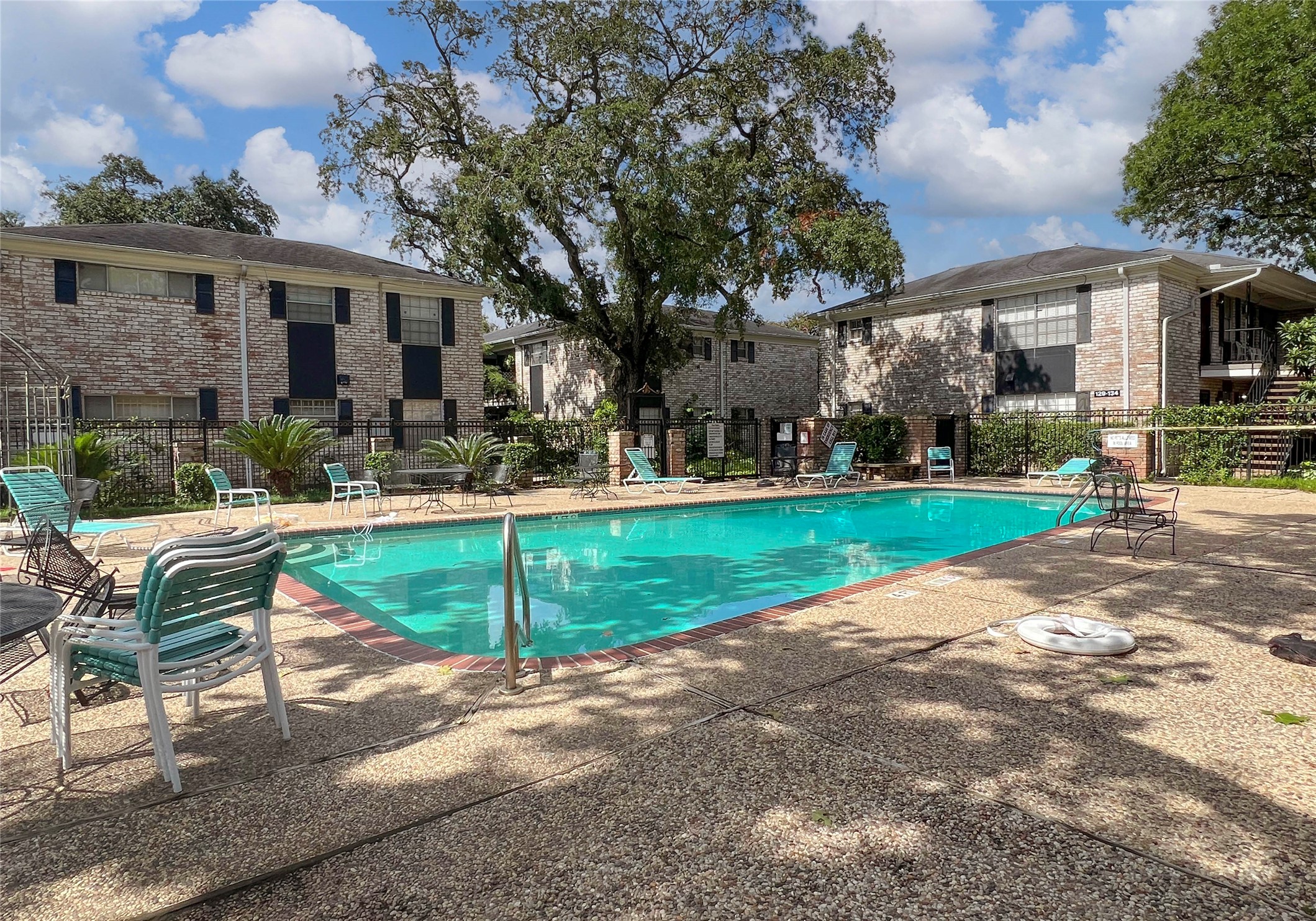 7900 Westheimer Road, Unit 134 Houston, TX 77063 - Photo 3 of 25 a view of a house with a yard porch and sitting area