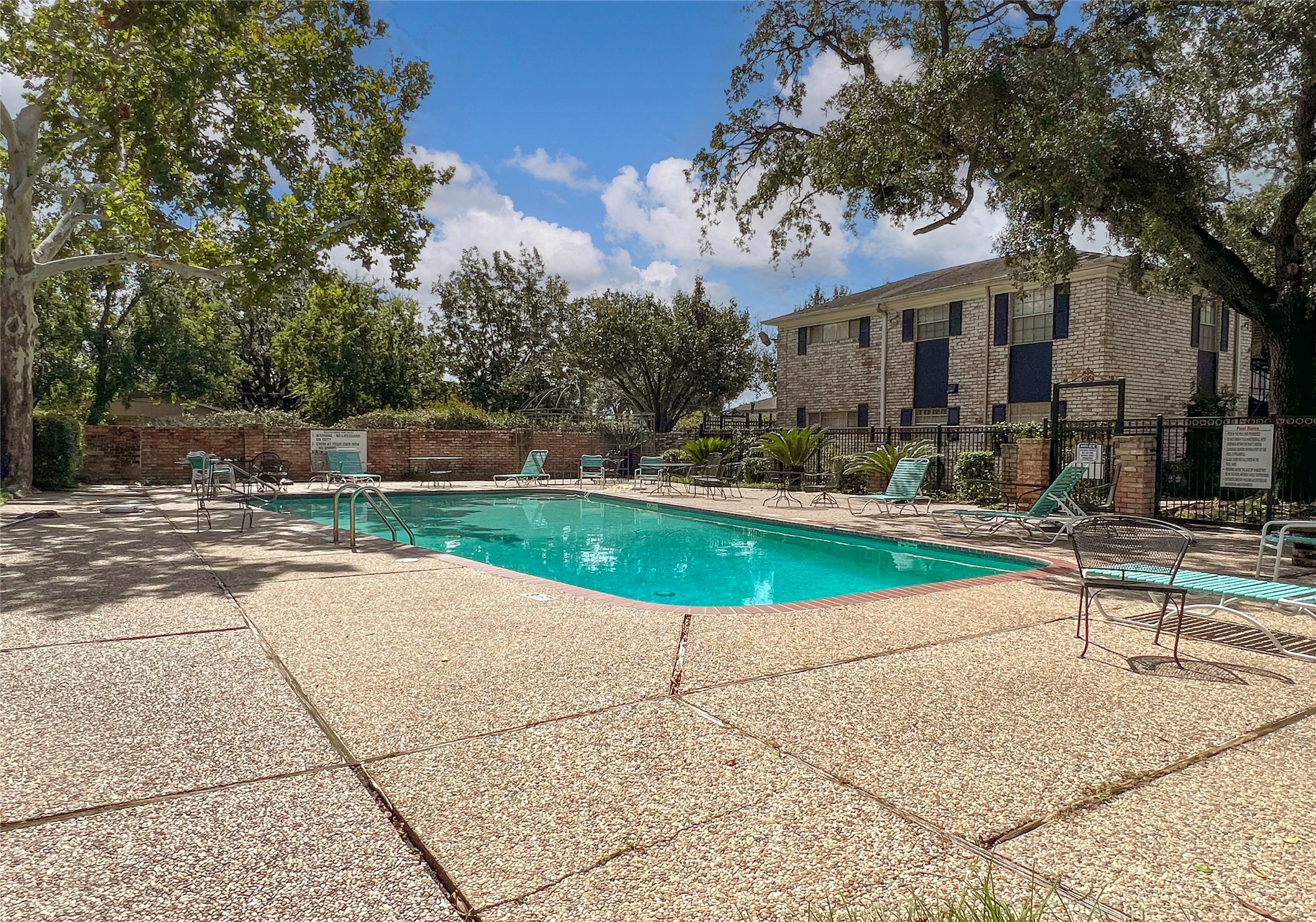 7900 Westheimer Road, Unit 134 Houston, TX 77063 - Photo 4 of 25 a view of a swimming pool with a patio