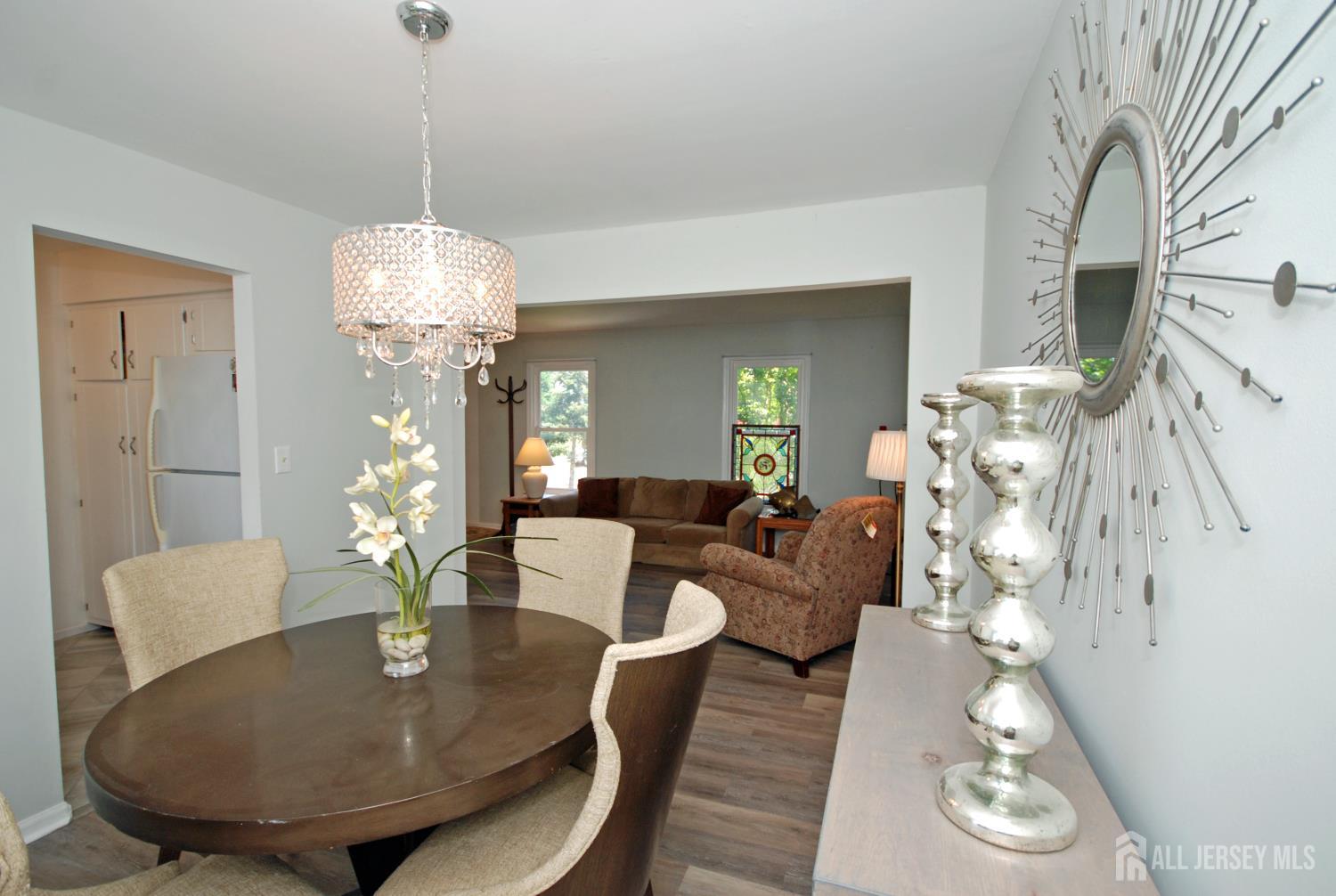 4 Kalman Court Middlesex, NJ 08846 - Photo 14 of 30 a living room with furniture and a chandelier