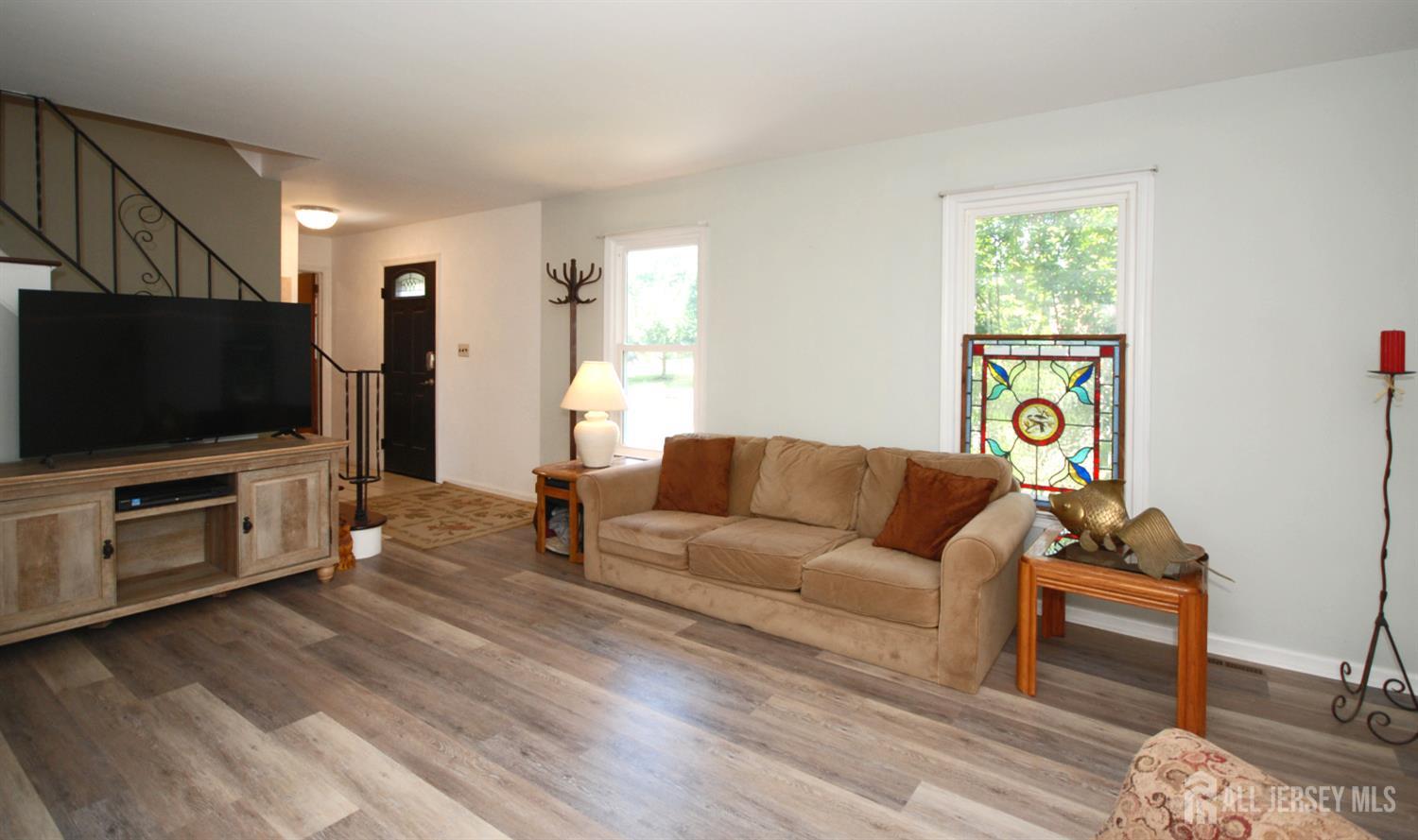 4 Kalman Court Middlesex, NJ 08846 - Photo 15 of 30 a living room with furniture and a flat screen tv