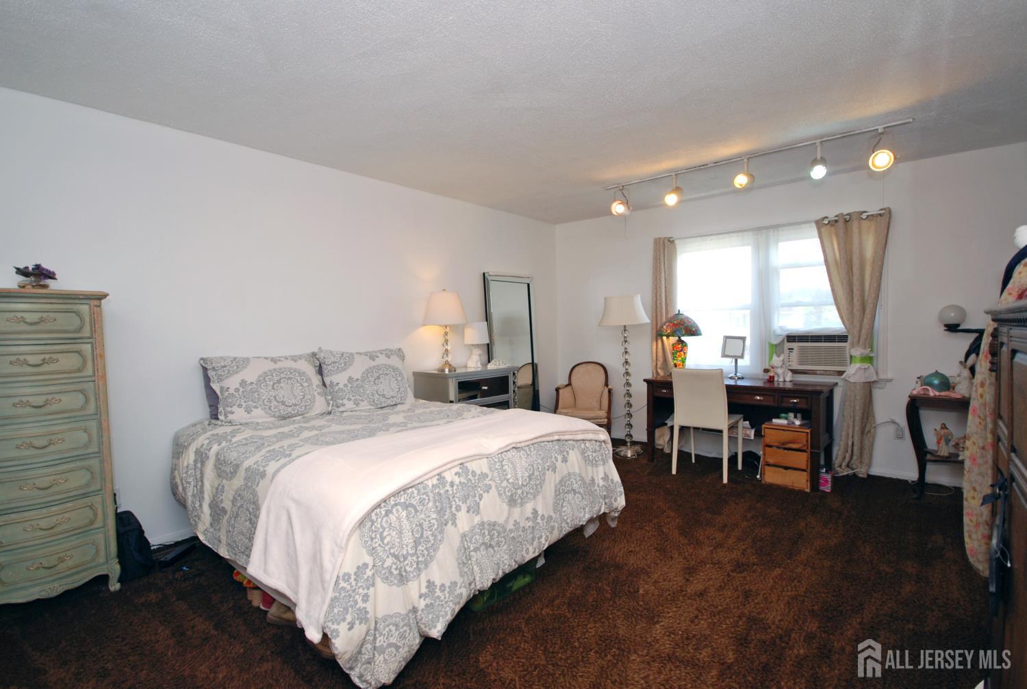 4 Kalman Court Middlesex, NJ 08846 - Photo 18 of 30 a bed room with a bed window and a chair