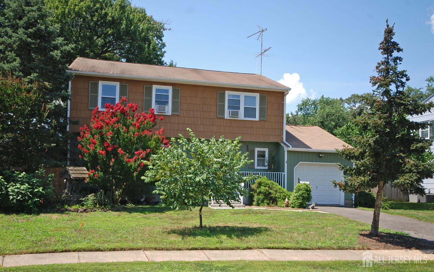 4 Kalman Court Middlesex, NJ 08846 - Photo 2 of 30 a front view of a house with a yard