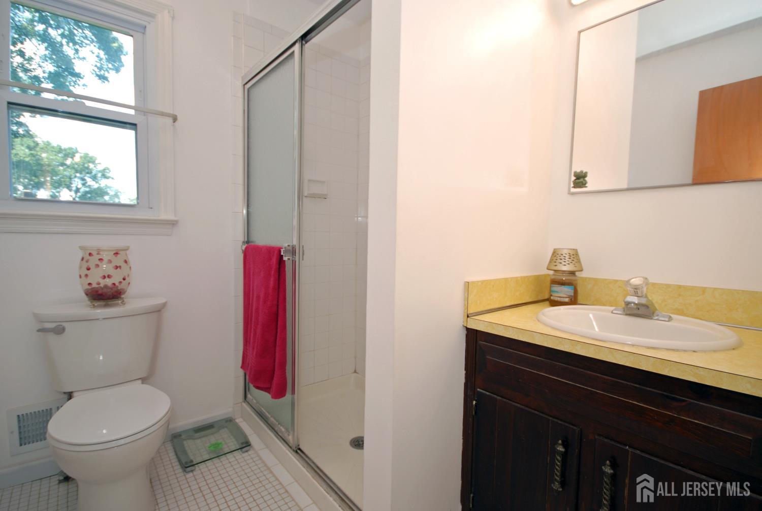 4 Kalman Court Middlesex, NJ 08846 - Photo 21 of 30 a bathroom with a toilet a sink and a mirror