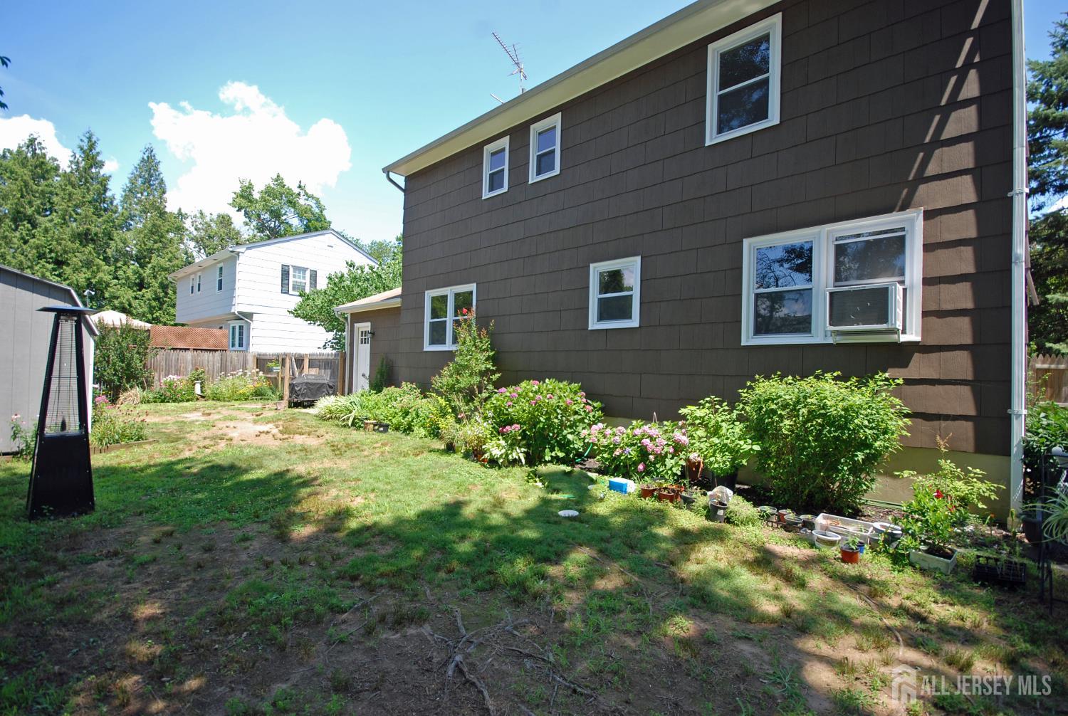 4 Kalman Court Middlesex, NJ 08846 - Photo 3 of 30 a front view of a house with a yard