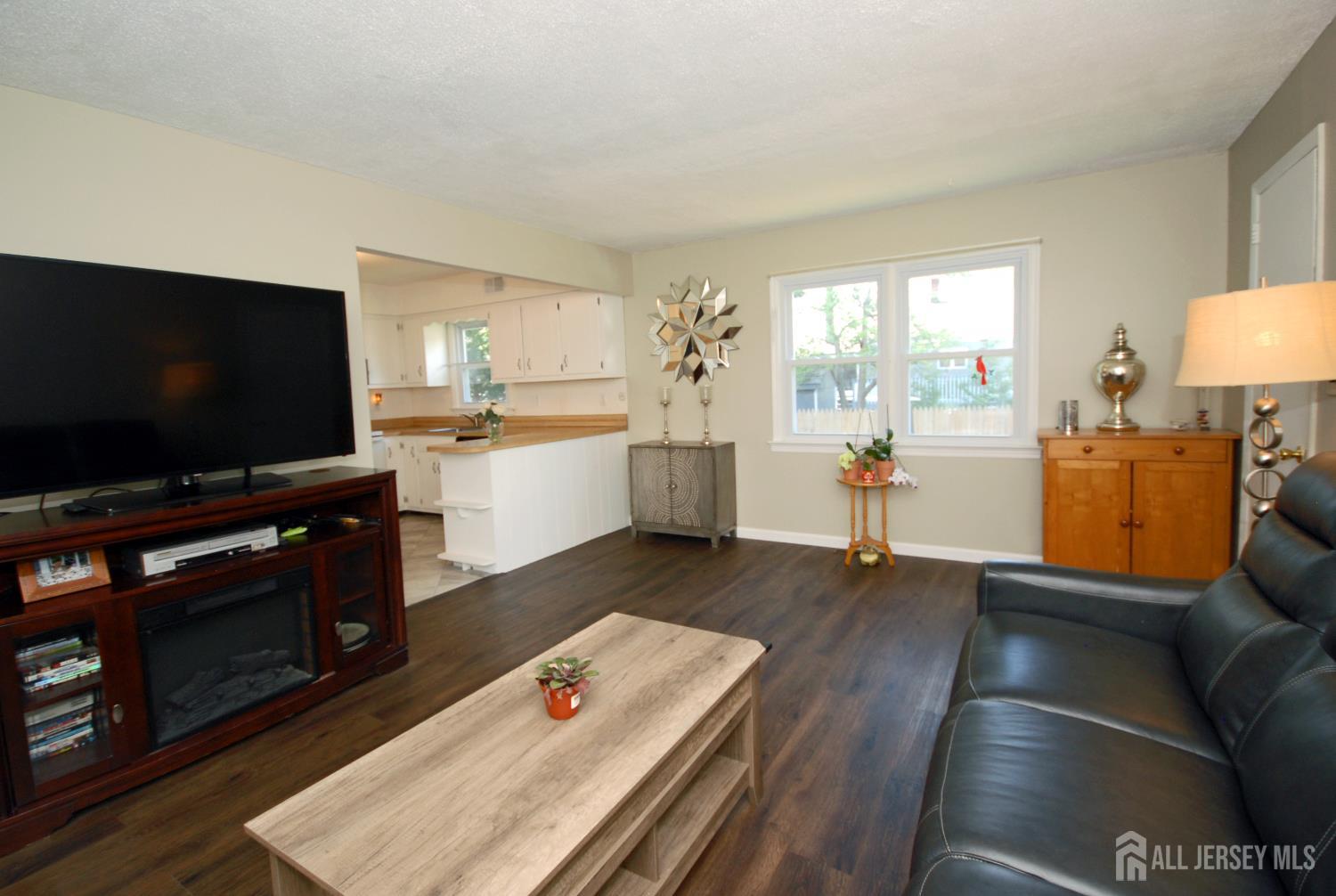4 Kalman Court Middlesex, NJ 08846 - Photo 4 of 30 a living room with furniture and a flat screen tv
