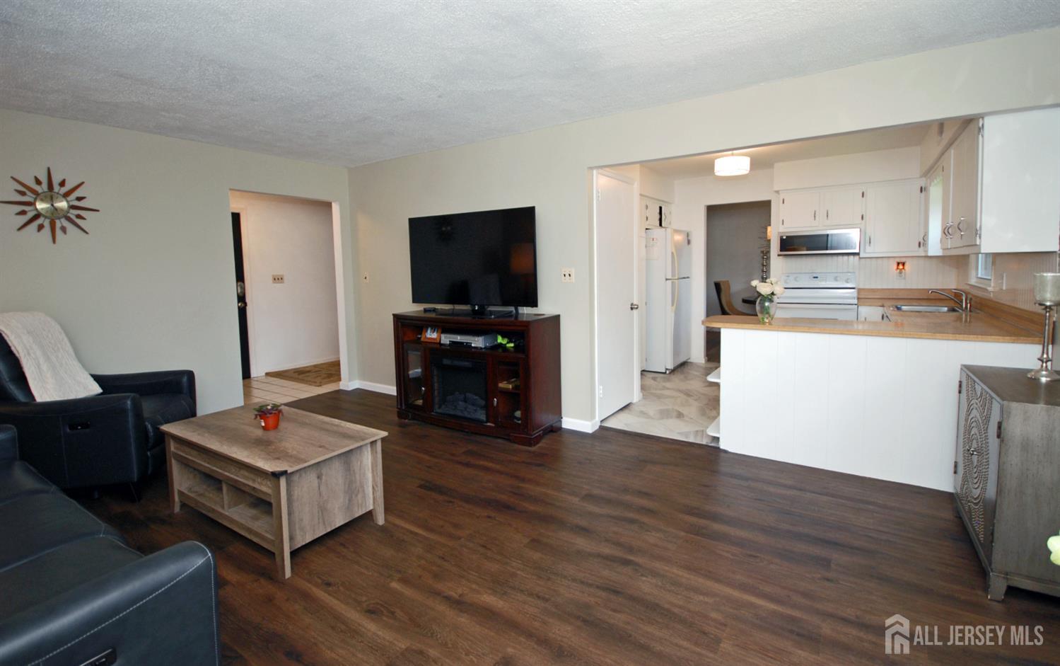 4 Kalman Court Middlesex, NJ 08846 - Photo 7 of 30 a living room with furniture and a flat screen tv