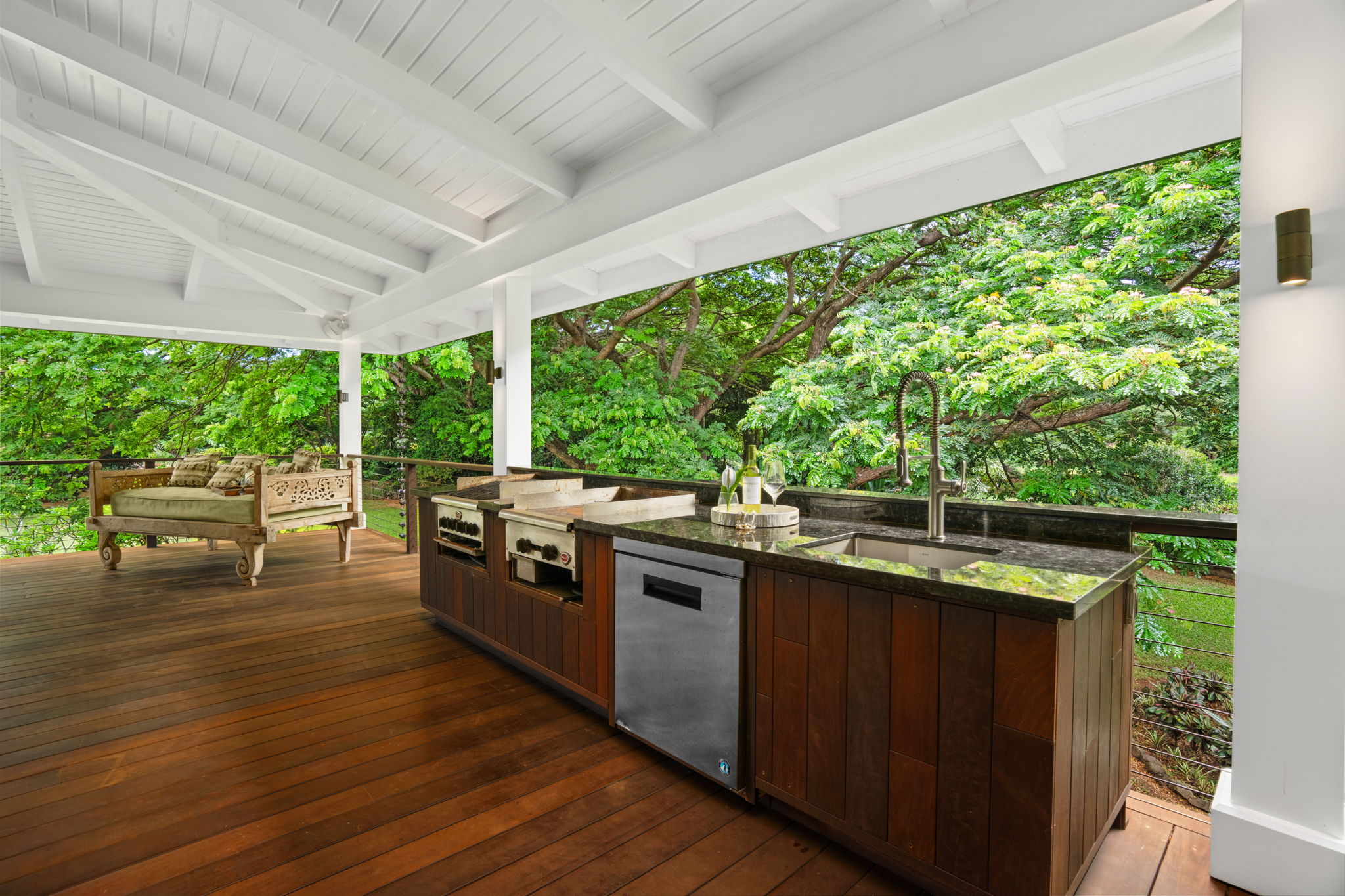 5311 A Hauaala Road Kapaa, HI 96746 - Photo 12 of 30 a kitchen with stainless steel appliances wooden cabinets and wooden floor