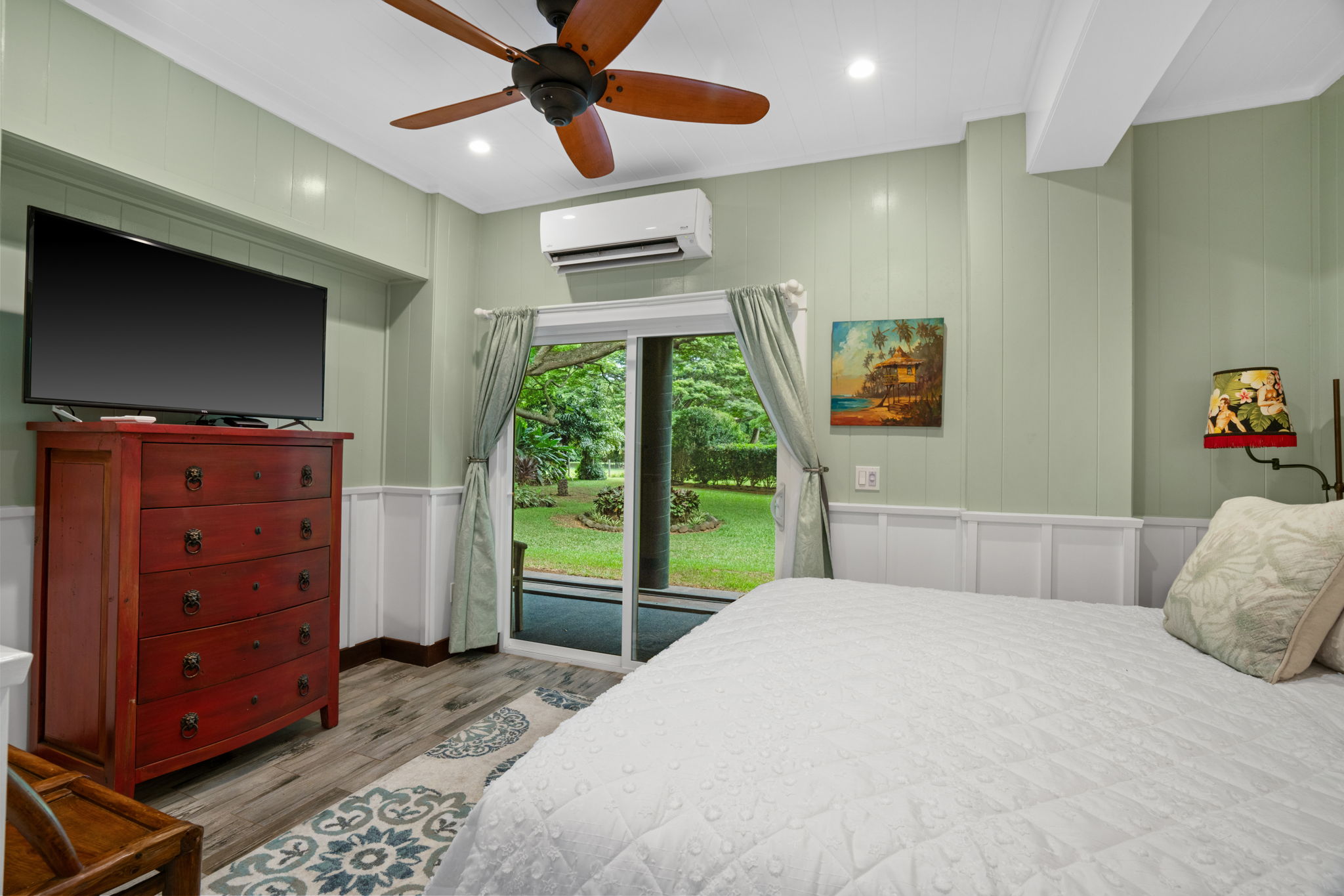 5311 A Hauaala Road Kapaa, HI 96746 - Photo 18 of 30 a bedroom with a bed and a flat screen tv