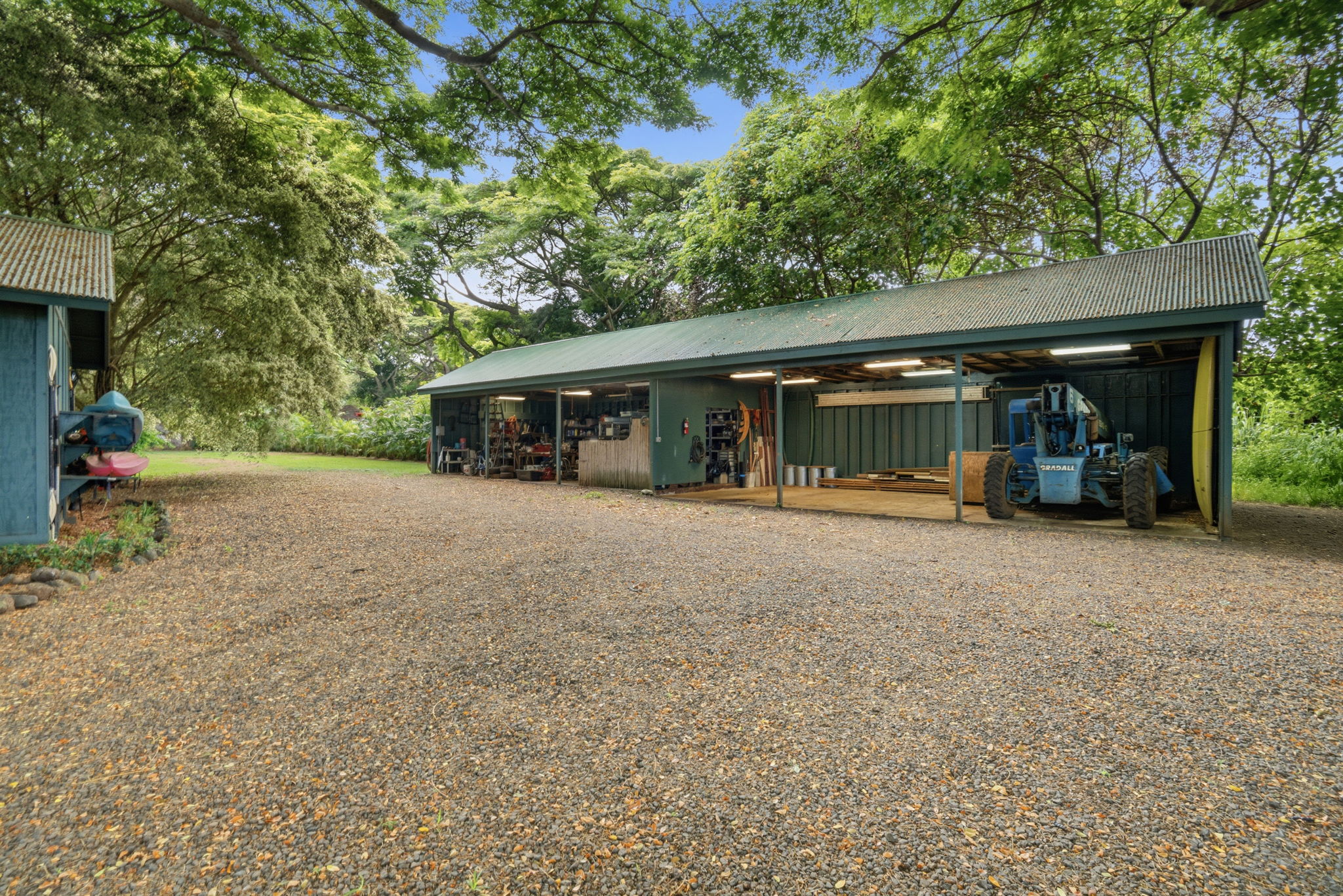 5311 A Hauaala Road Kapaa, HI 96746 - Photo 26 of 30 a view of house with backyard and glass windows