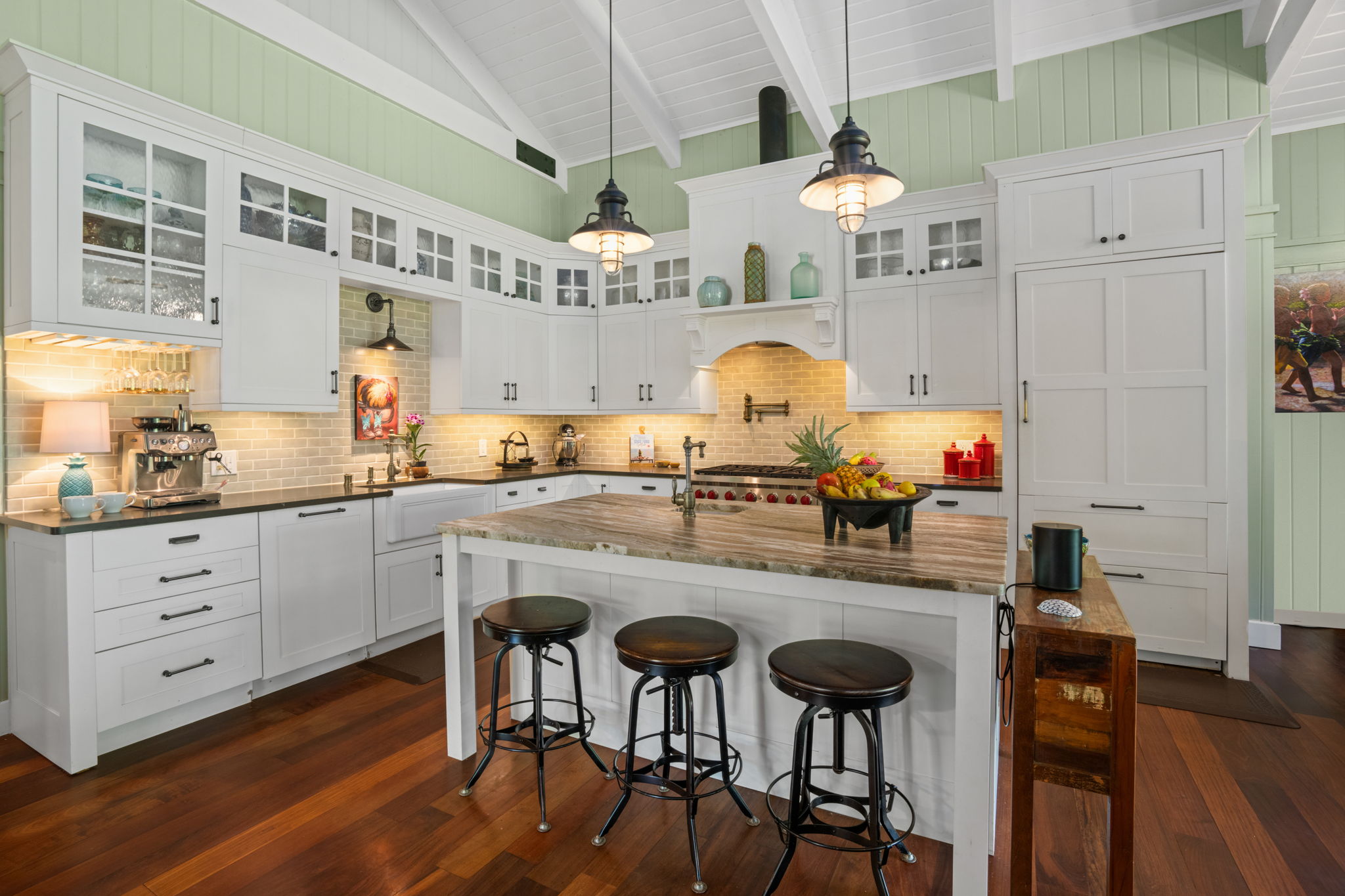 5311 A Hauaala Road Kapaa, HI 96746 - Photo 3 of 30 a kitchen with stainless steel appliances a dining table chairs stove and cabinets