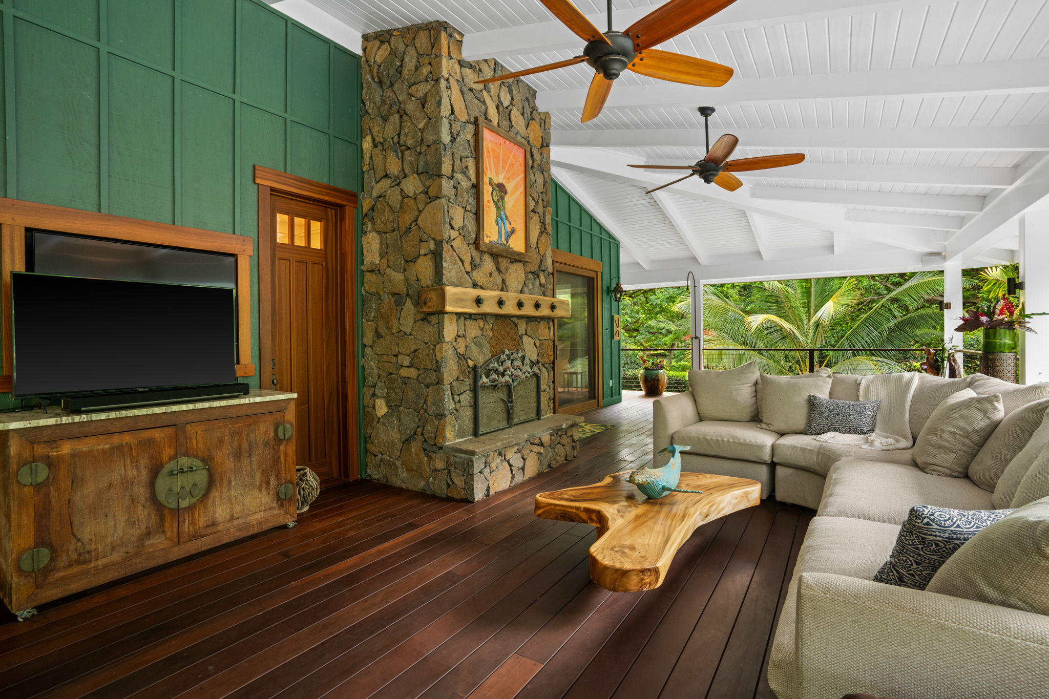5311 A Hauaala Road Kapaa, HI 96746 - Photo 7 of 30 a living room with furniture a flat screen tv and a floor to ceiling window