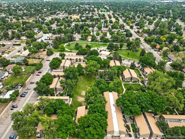 an aerial view of residential houses with outdoor space