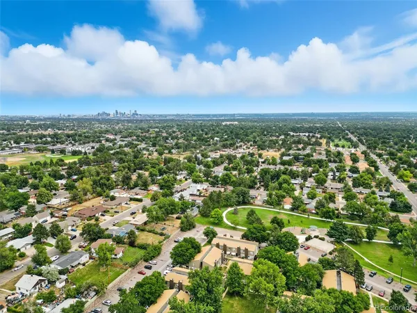 an aerial view of a house with a yard and garden