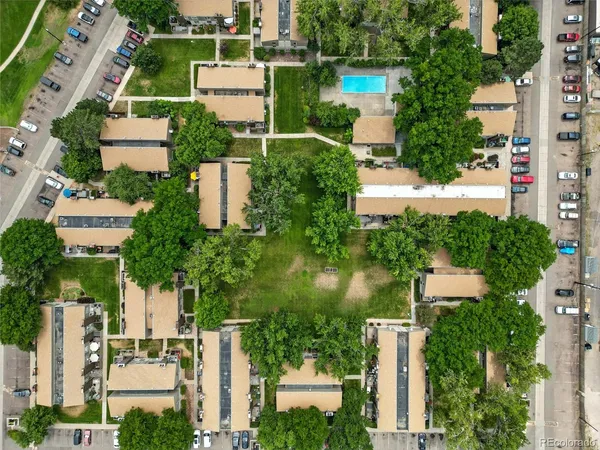an aerial view of a house with outdoor space and street view