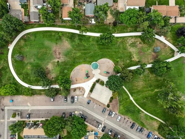 a picture of a bench in front of a wall