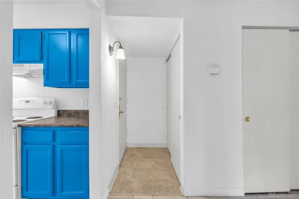 a view of hallway with cabinets