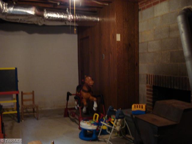 182 Eller Road Winston-Salem, NC 27107 - Photo 13 of 15 Other. Basement with fireplace and woodstove, this area already sectioned off; easily finished!