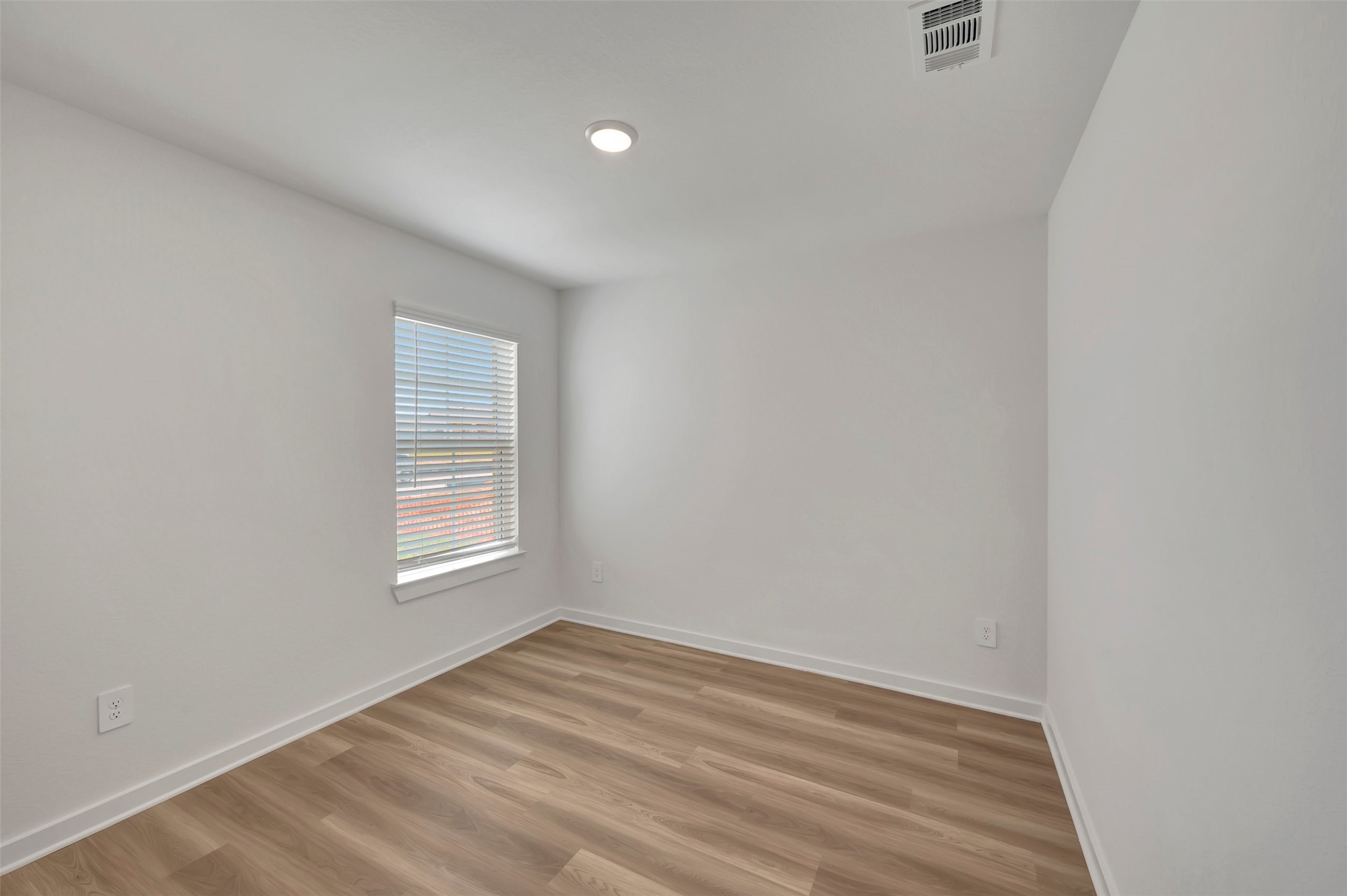 759 Hackberry Branch Magnolia, TX 77354 - Photo 28 of 43 an empty room with wooden floor and windows