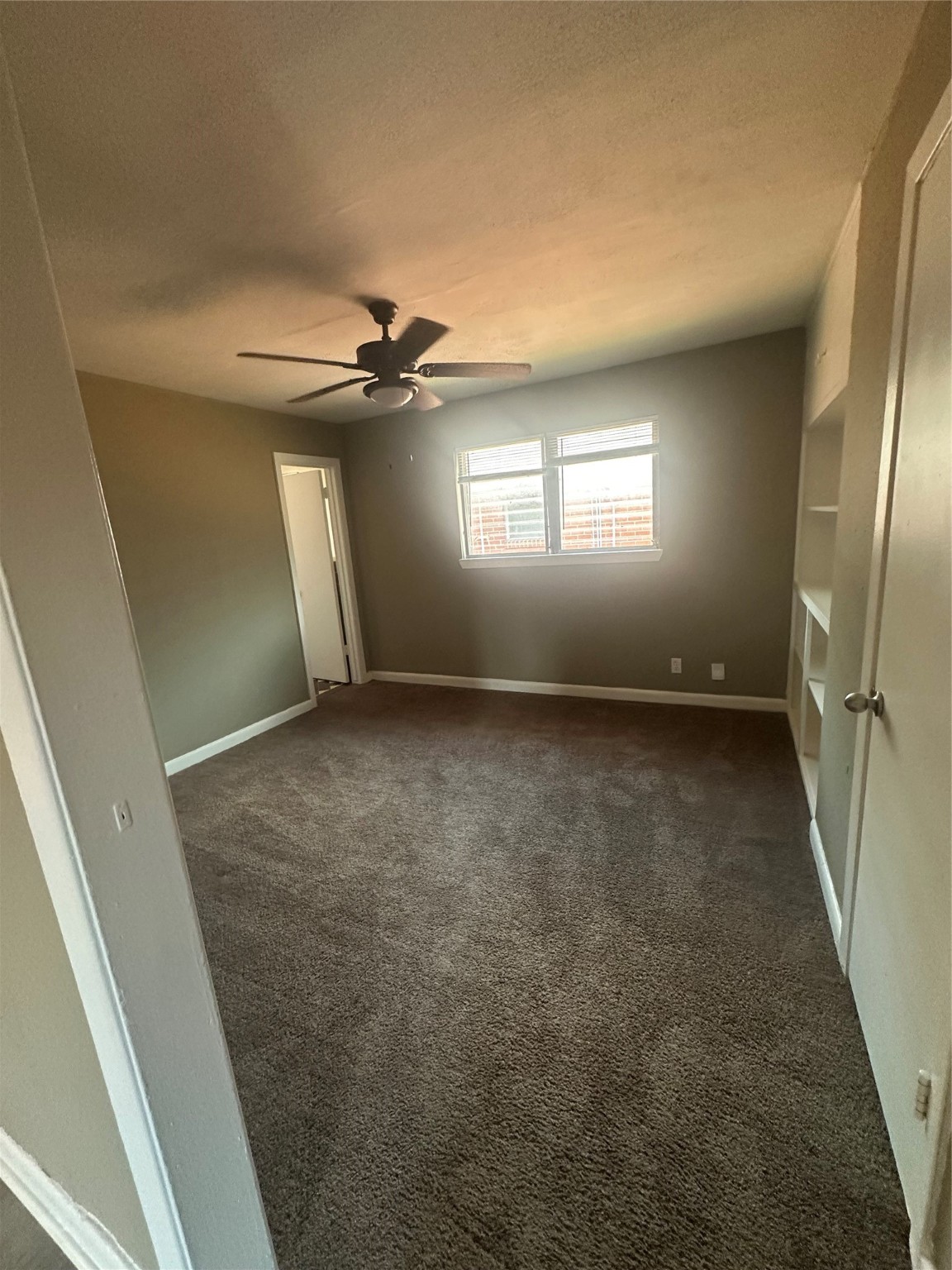 5906 Ardmore Street, Unit 4 Houston, TX 77021 - Photo 5 of 9 an empty room with windows and entrance