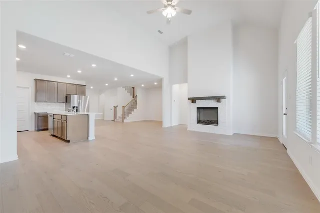 a view of a kitchen with a sink and a fireplace