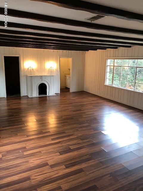 2300 Upper River Road Macon, GA 31211 - Photo 11 of 32 an empty room with wooden floor and windows