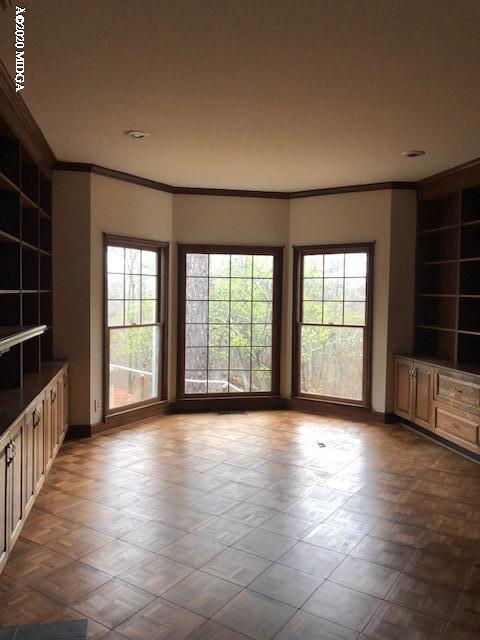2300 Upper River Road Macon, GA 31211 - Photo 13 of 32 wooden floor in an empty room with a window