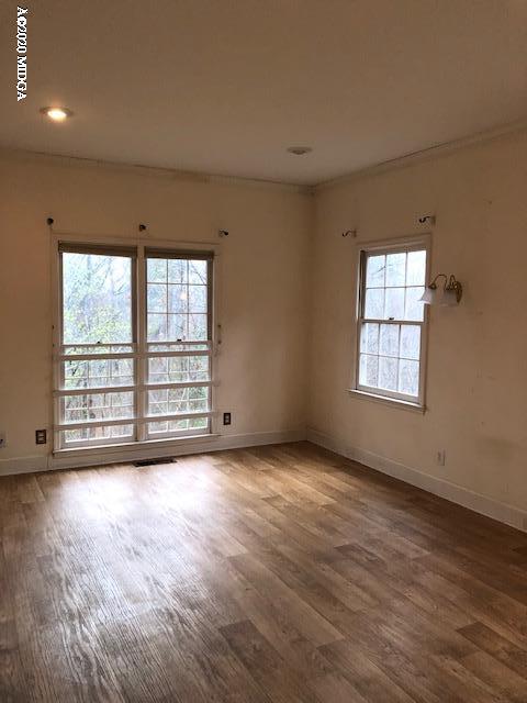 2300 Upper River Road Macon, GA 31211 - Photo 16 of 32 an empty room with wooden floor and windows