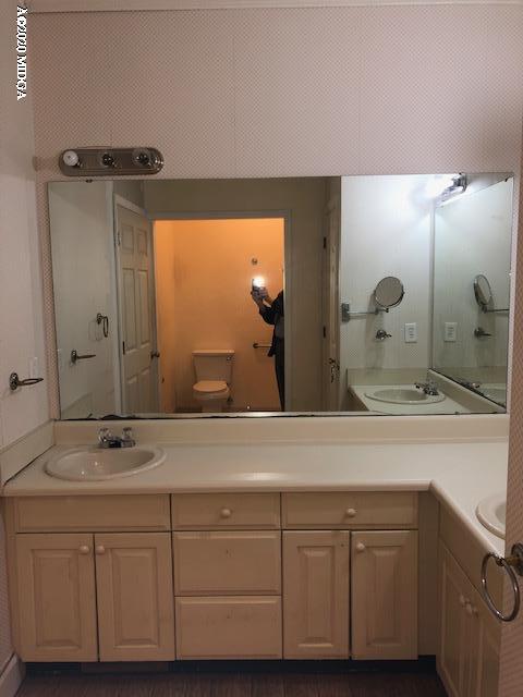 2300 Upper River Road Macon, GA 31211 - Photo 19 of 32 a bathroom with a double vanity sink and mirror