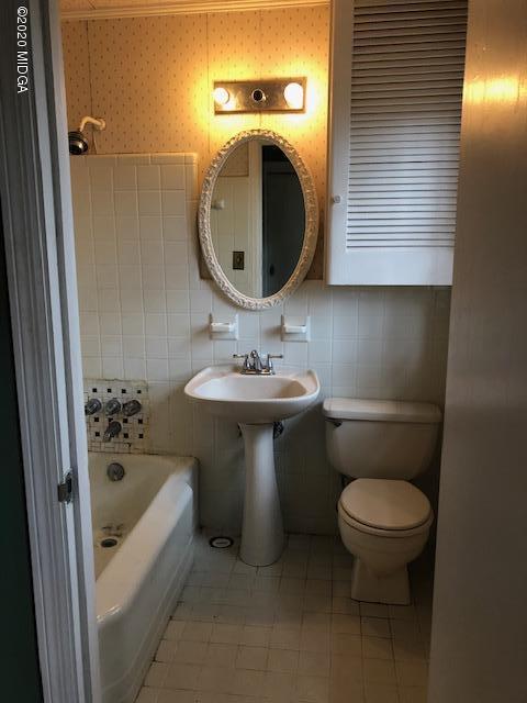 2300 Upper River Road Macon, GA 31211 - Photo 31 of 32 a bathroom with a sink toilet and shower