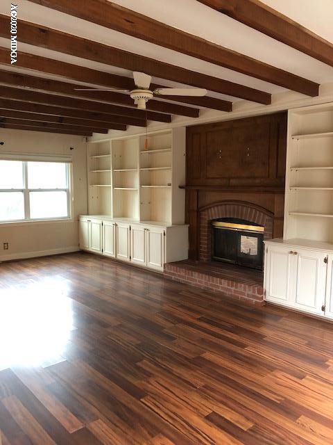 2300 Upper River Road Macon, GA 31211 - Photo 8 of 32 a view of empty room with wooden floor and fireplace