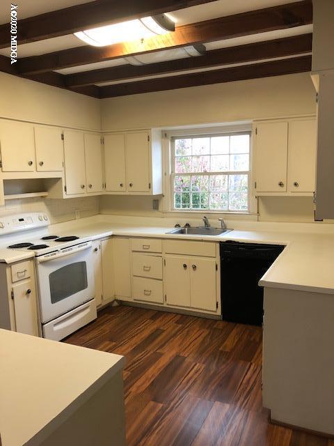 2300 Upper River Road Macon, GA 31211 - Photo 9 of 32 a kitchen with a sink a stove and cabinets