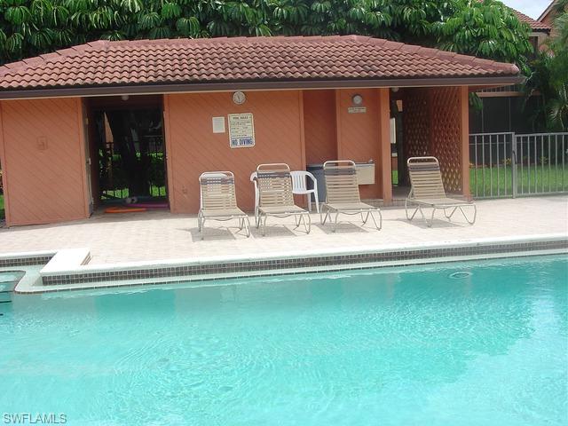 110 Cypress Way East, Unit F5 Naples, FL 34110 - Photo 4 of 11 a view of a house with backyard space