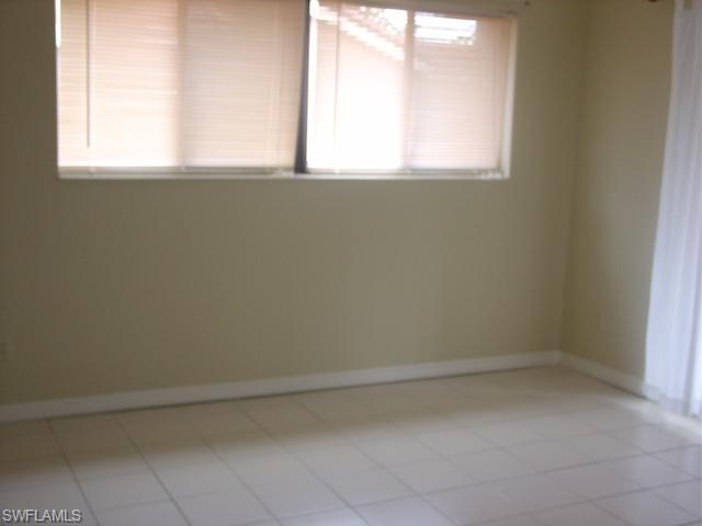 110 Cypress Way East, Unit F5 Naples, FL 34110 - Photo 6 of 11 a view of a window in a room